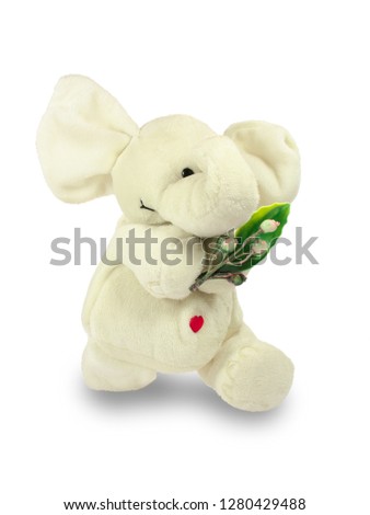 Valentine's Day, a red heart, a white plush elephant, carries a green branch. Isolated object on a white background, closeup.