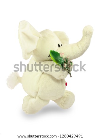 Valentine's Day, red heart, white plush elephant, walks with a green branch. Isolated object on a white background, closeup.
