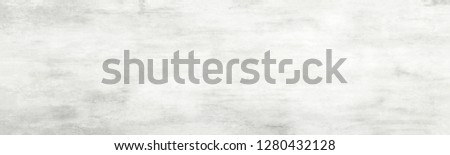 Long ultra wide white light panoramic wallpaper. Monochrome texture background with white and gray color.Grunge old wall texture, concrete.