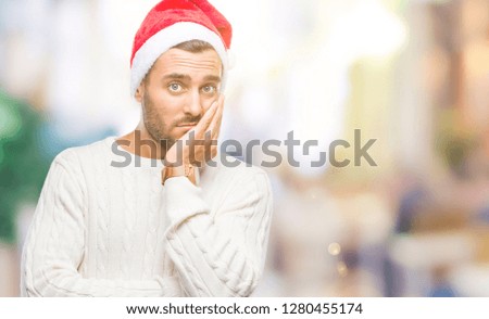 Young handsome man wearing santa claus hat over isolated background thinking looking tired and bored with depression problems with crossed arms.
