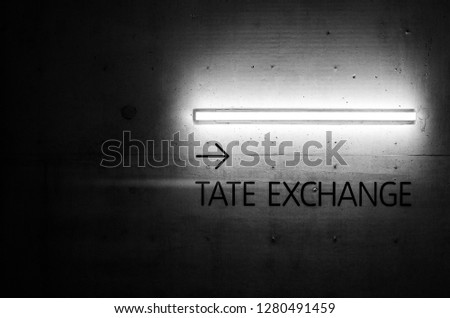tate exchange neon on tate modern stairs