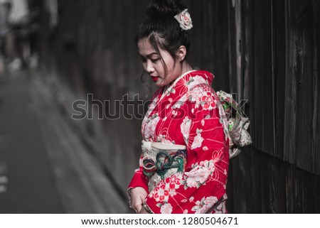 Beautiful girl wearing japanese traditional kimono in Kyoto