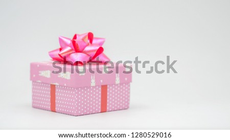 Pink gift box with pink ribbon on a white background Congratulations on various occasions - pictures