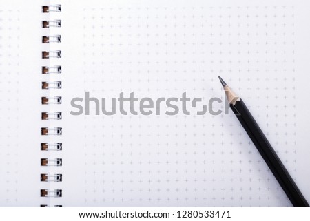 Wooden pencil put on notebook with copy space. Pencil on page, the blogger instrument, desktop of businessman