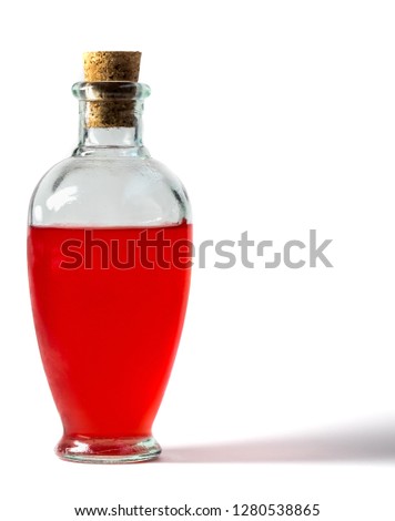 Corked bottle of mysterious red liquid Royalty-Free Stock Photo #1280538865