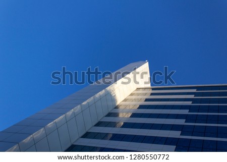 Modern bussines city high building construction on blue sky background