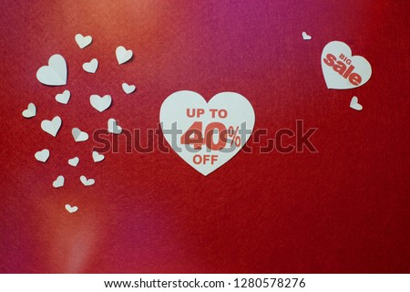 White heart with number forty for big sale on a red background. 40 per cent off for Valentines day