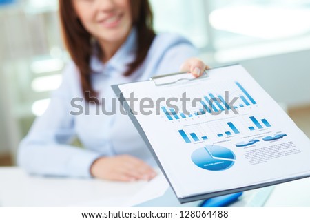 Image of business document being shown by female Royalty-Free Stock Photo #128064488