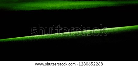 texture, background, pattern. green silk fabric panoramic photo. Silk Duke mood Satin is a beautiful and royal silk fabric. It has a shimmering shine,