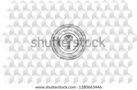tree icon inside grey badge with geometric cube white background