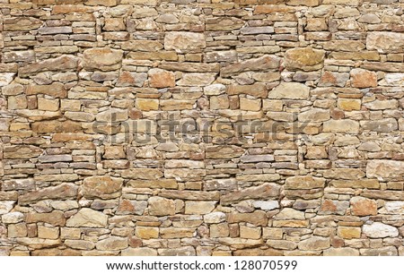 Stone wall rustic texture big seamless background Royalty-Free Stock Photo #128070599