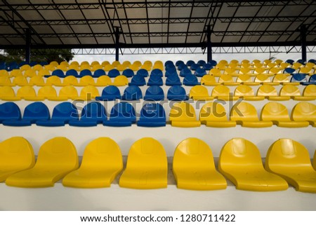 stadium seats, blue and yellow