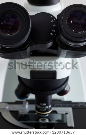 Microscope and microscope glass slide closeup macro, backlit, white background