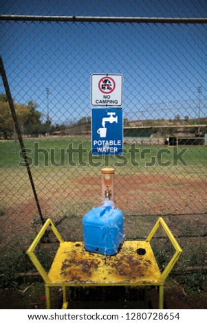Portable drinking water sign at tourist camp ground Tomprice, Pilbara region, Perth, Western of Australia