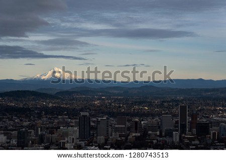 Cityscape of Portland Oregon with amazing clouds and Mount Hood 