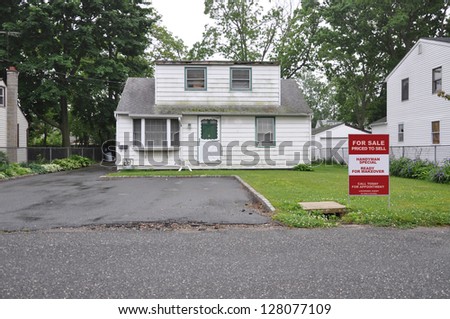 Real Estate Realtor For Sale Sign Handyman Special Bungalow Home in bad condition with Dormer Extension