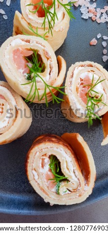 Pancakes with  smoked salmon, cream  cheese and dill. Party food 