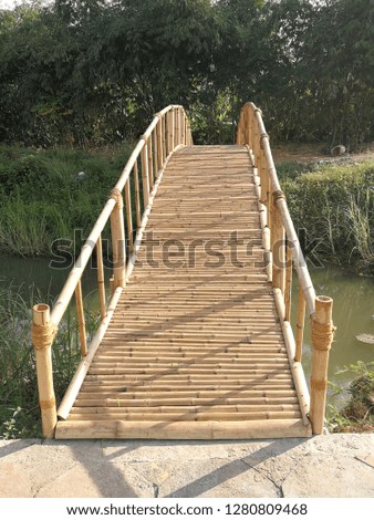 Bridge over water canal Made from bamboo Suitable for building according to tourist attractions Let people walk across and take pictures Or as a background image at Ban Mung Subdistrict, Noen Maprang 