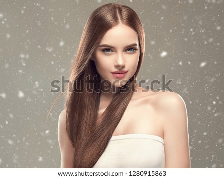 Beautiful woman hair and skin beauty winter background snowflakes