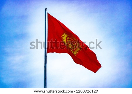 Kyrgyzstan flag front of blue sky