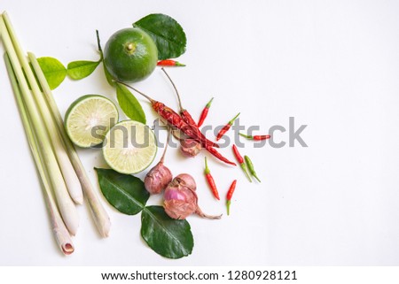 Ingredients of Thai spicy food "Tomyum" spicy soup. lemon, chilli, Red onion, lemon grass, Kaffir, lime leaves. Top view, copy space. 