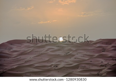 Morocco desert landscape suitable for backgrounds and advertising with brown, blue and pink tones
