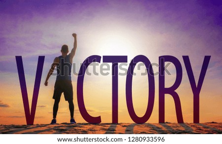 Man celebrating success. Victory text and person as silhouettes against sun in sky.