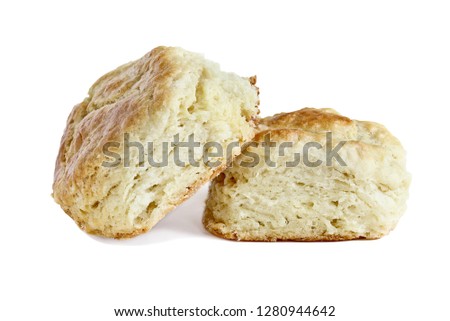 Two buttermilk southern biscuits or scones isolated over a white background with light shadow and clipping path..