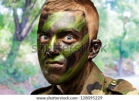 portrait of a mad soldier against a nature background