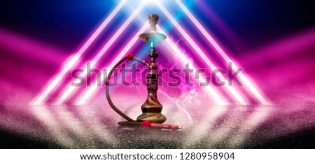 Hookah smoking on the background of an empty scene with a concrete floor, neon lights and smoke. Background trend color plastic pink