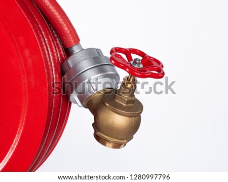Fire valve connected to red fire hose
