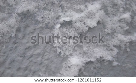 old gray wall in hoarfrost