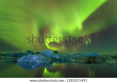 Beautiful panoramic Aurora Borealis or better known as The Northern Lights for background view in Iceland, Jokulsarlon during winter Dreamy atmosphere. Winter time, Christmas and Happy new year