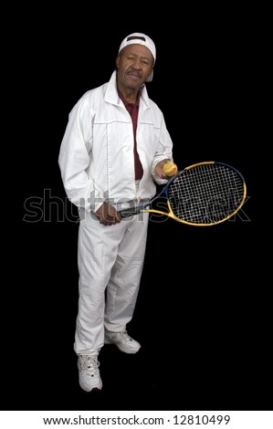 African American active senior citizen tennis player isolated over black background