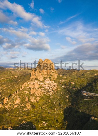 ancient abandoned village called Pentedattilo in Calabria on a mountain. Aerial view.
