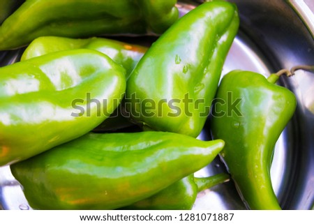 Roasted green peppers on a pan