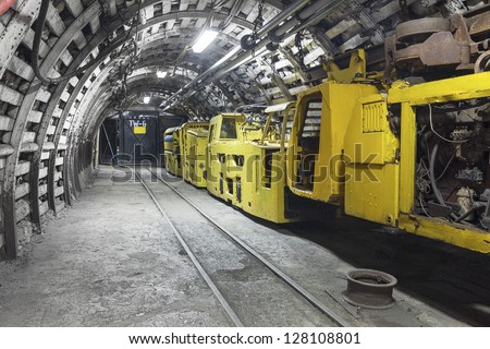 Yellow coal mine transporter Royalty-Free Stock Photo #128108801