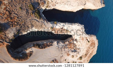 Aerial drone photo of famous caves of Papafragas in volcanic island of Milos, Cyclades, Greece