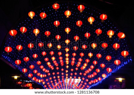 Night scene of red comp lamp lantern Chinese style hanging decorated in Chinese New Year Celebration in Thailand. 