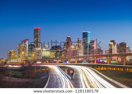 Houston, Texas, USA downtown skyline over the highways at dusk. 