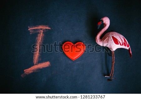 I love the Flamingo, the symbol of the heart of flamingos and the letter I on a dark background.