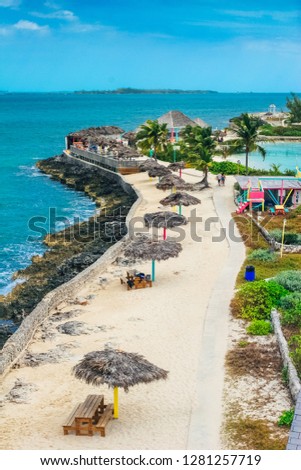 Aerial view on the exotic island with blue sea around during sunny day. Pearl Island in Nassau, Bahamas. Royalty-Free Stock Photo #1281257719