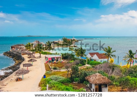 Aerial view on the exotic island with blue sea around during sunny day. Pearl Island in Nassau, Bahamas. Royalty-Free Stock Photo #1281257728