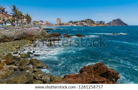 Coast line of Mazatlan city in Mexico. Rocky beach and the blue Ocean.   Royalty-Free Stock Photo #1281258757