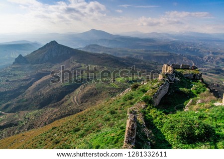 Acrocorinth, Upper Corinth fortress, the acropolis of ancient Corinth, is a monolithic rock overseeing the ancient city of Corinth, Greece. Archaeological site of Acrocorinth, the acropolis of Korinth Royalty-Free Stock Photo #1281332611