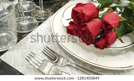 Red rose flower on table in living room, home decoration