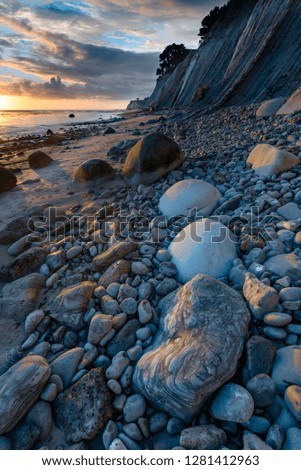 USA, California. Sunset on the emerging rocks at Bowling Ball Beach, Schooner Gulch State Beach