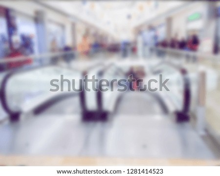 Abstract blur image of Shopping mall with bokeh for background and modern escalator 