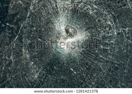 Close-up of broken windshield after car accident