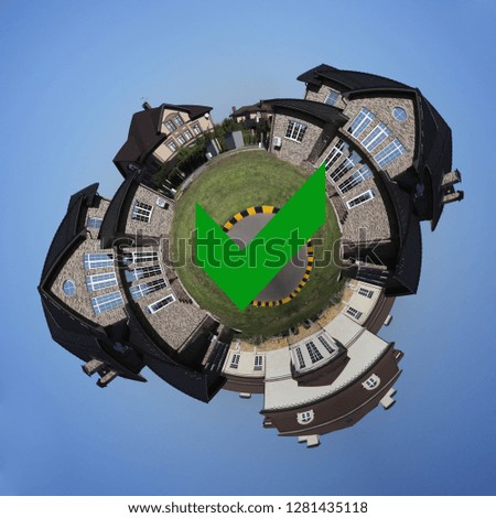 Little planet of new homes with the sign COMPLETED. Aerial view panorama 360 degree.